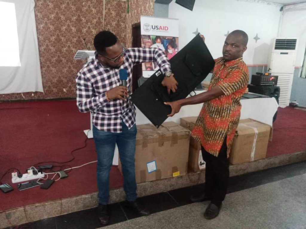 Victor training health workers on the usage of the gadget
