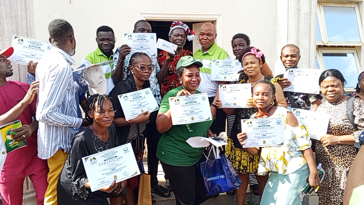 Some of the participants of the event showcasing their certificates and devices